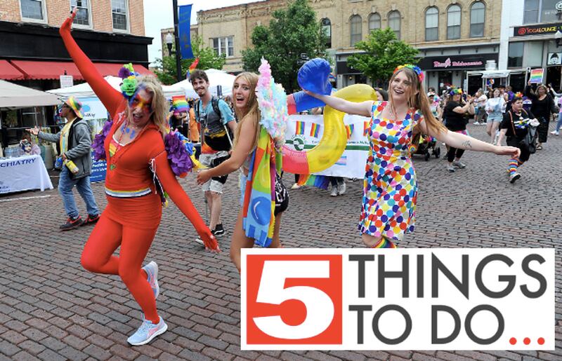 Vicki, Gigi and Jayley Clark dance during the Woodstock PrideFest Parade Sunday, June 12, 2022, around the historic Woodstock Square.