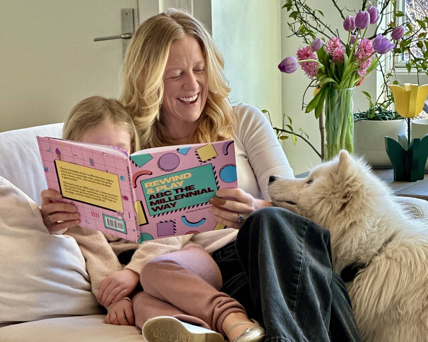 St. Charles local author and illustrator Emma Knuckman reads her book “Rewind & Play: ABC The Millennial Way” to her daughter Jane.