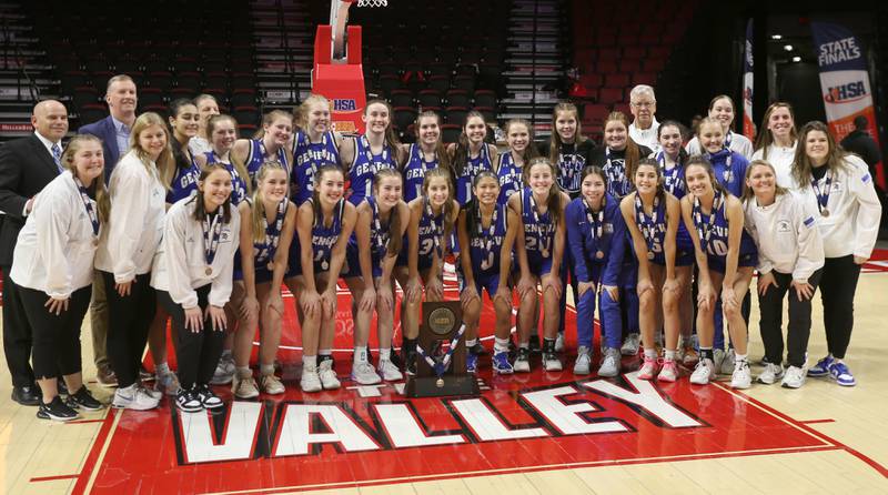 Members of the Geneva girls basketball team pose with their Class 4A third place trophy after defeating Geneva during the third place game on Friday, March 3, 2023 at CEFCU Arena in Normal.