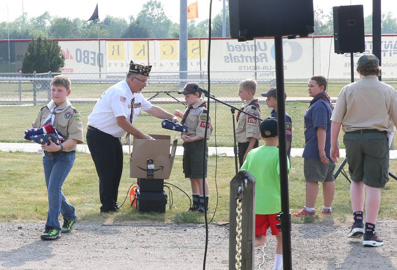 Boy Scout Troop 123 and Cub Scout Troop 3709 of Peru, burn American Flags during the Flag Retirement Ceremony on Wednesday, June 14, 2023 at Veterans Park in Peru. Each year on Flag Day, the group retires flags while holding a ceremony with Boy Scout Troop 123 and Cub Scout 3709 from Peru.