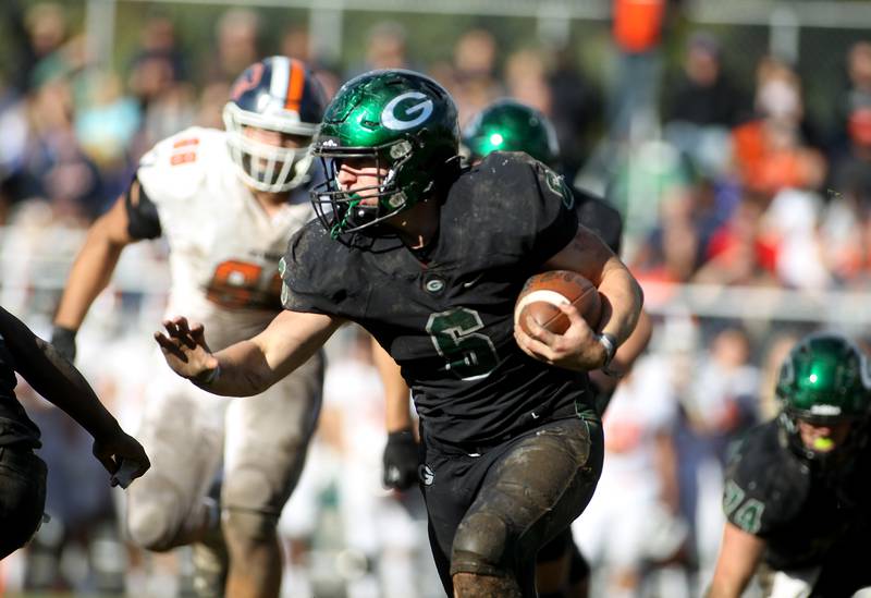 Glenbard West's Jack Oberhofer carries the ball during a Class 8A playoffs first-round game against Oswego in Glen Ellyn on Saturday, Oct. 30, 2021.