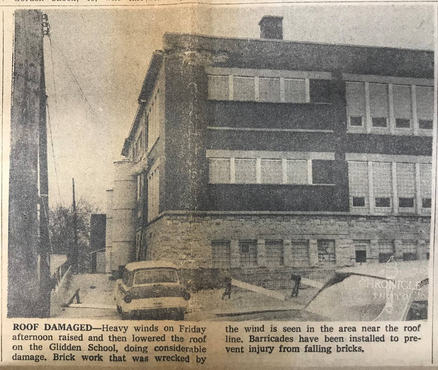 Heavy winds on Friday afternoon raised and then lowered the roof on the Glidden School, doing considerable damage. Brick work that was wrecked by the wind is seen in the area near the roof line. Barricades have been installed to prevent injury from falling bricks. From the April 22, 1967 issue of The DeKalb Daily Chronicle, provided by the DeKalb County History Center Archives.