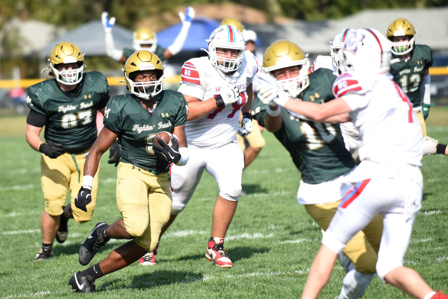 Bishop McNamara's Julius May runs the ball during a home game against Marian Central Saturday, Oct. 4, 2025. May would score on the play.