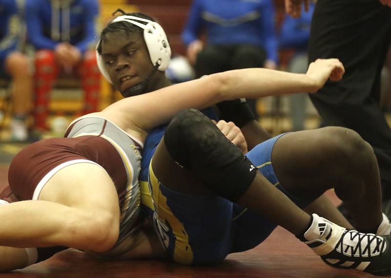 Johnsburg's CJ Ameachi spins out of the hold of Richmond-Burton's Breckin Campbell during the 215-pound match of a Kishwaukee River Conference wrestling match on Thursday, Jan. 25, 2024, at Richmond-Burton High School.