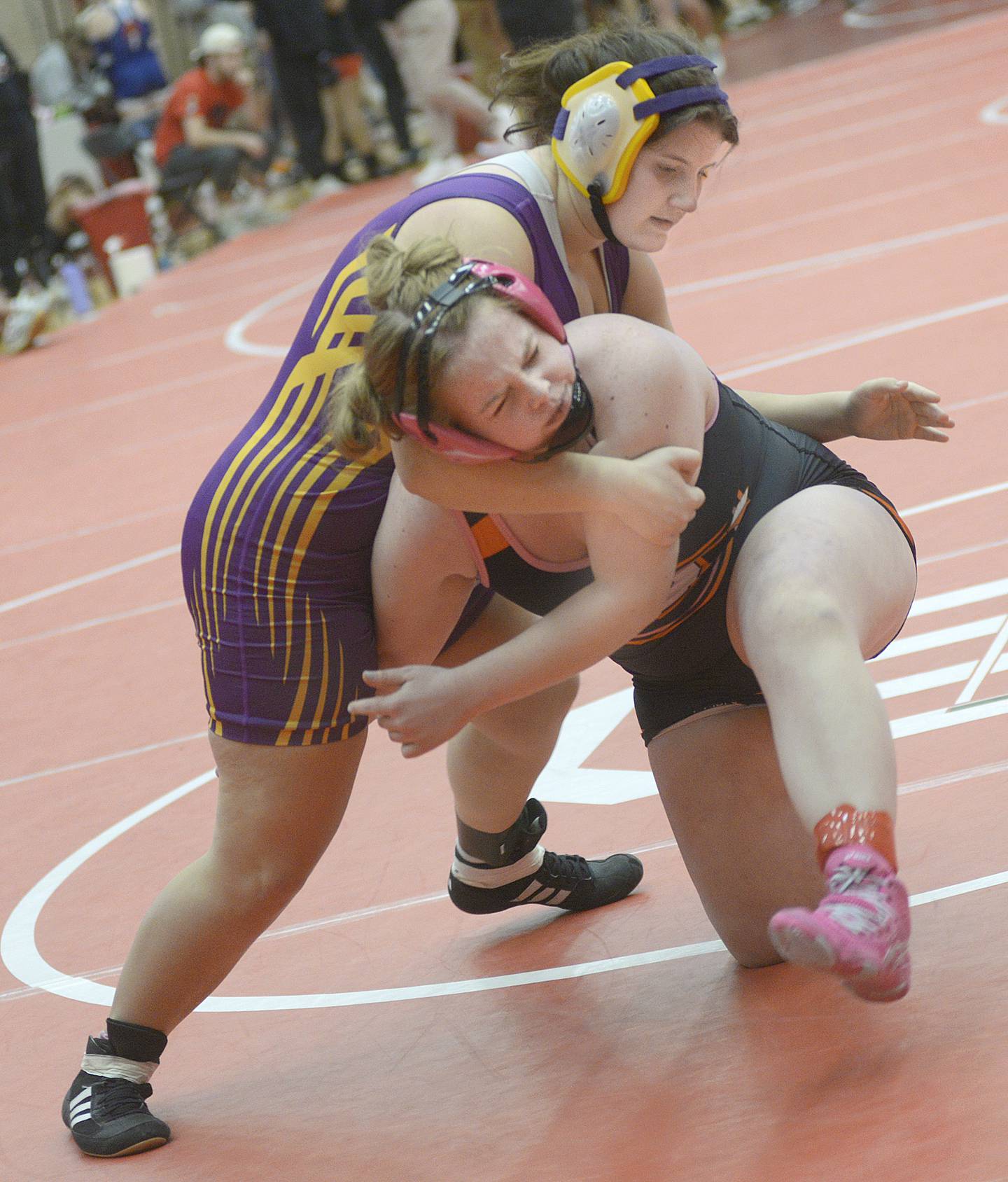 Mendota's Delila Kent (left) battles with Sandwich's Brooklyn Konczal in an Elite Bracket 170-pound bout at Monday's Ottawa Holiday Hootenanny Invite in Kingman Gymnasium.