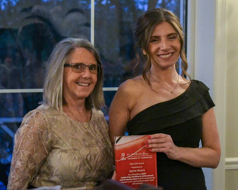 Jayme Muenz, right, poses with Rose Canfield after Muenz was presented with the St. Charles Area Chamber of Commerce's LEAP Award on Friday May 1, 2026.