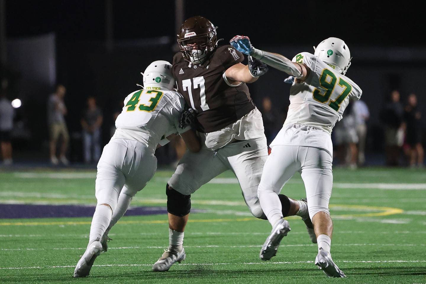 Joliet Catholic’s Cam Juricich holds off two Providence defenders on Friday, Sept. 1, 2023 Joliet Memorial Stadium.