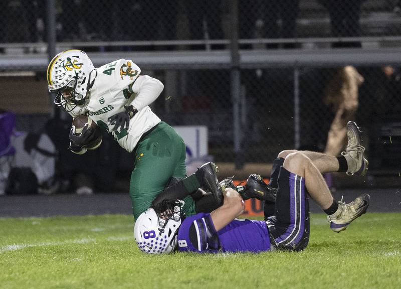 Dixon’s Bene Baratta hauls down Coal City’s Theo Fritz after a Duke’s punt block Friday, Nov. 7, 2025.
