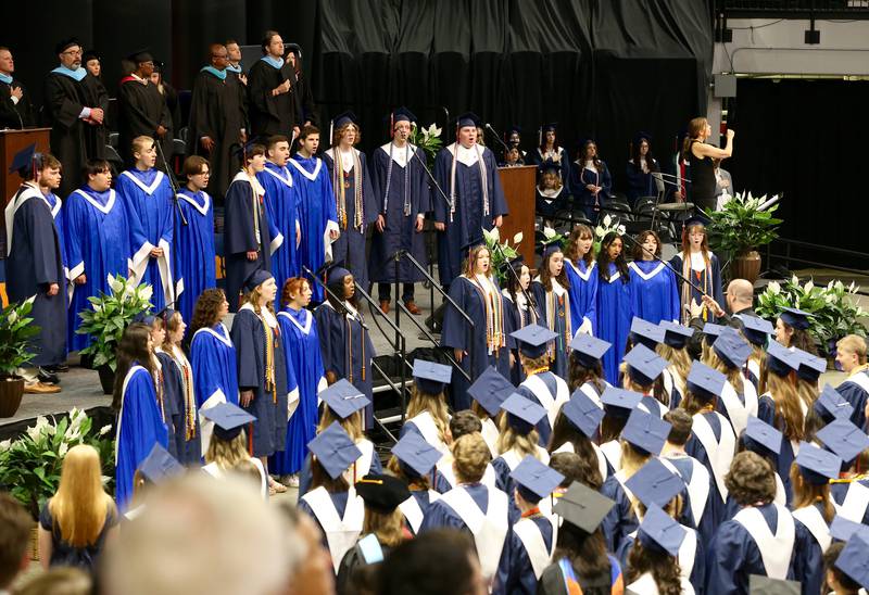 The Oswego High School A Capella Choir sings the Star Spangled Banner at the Oswego High School Class of 2024 Commencement Ceremony on Saturday, May 18, 2024 in DeKalb.