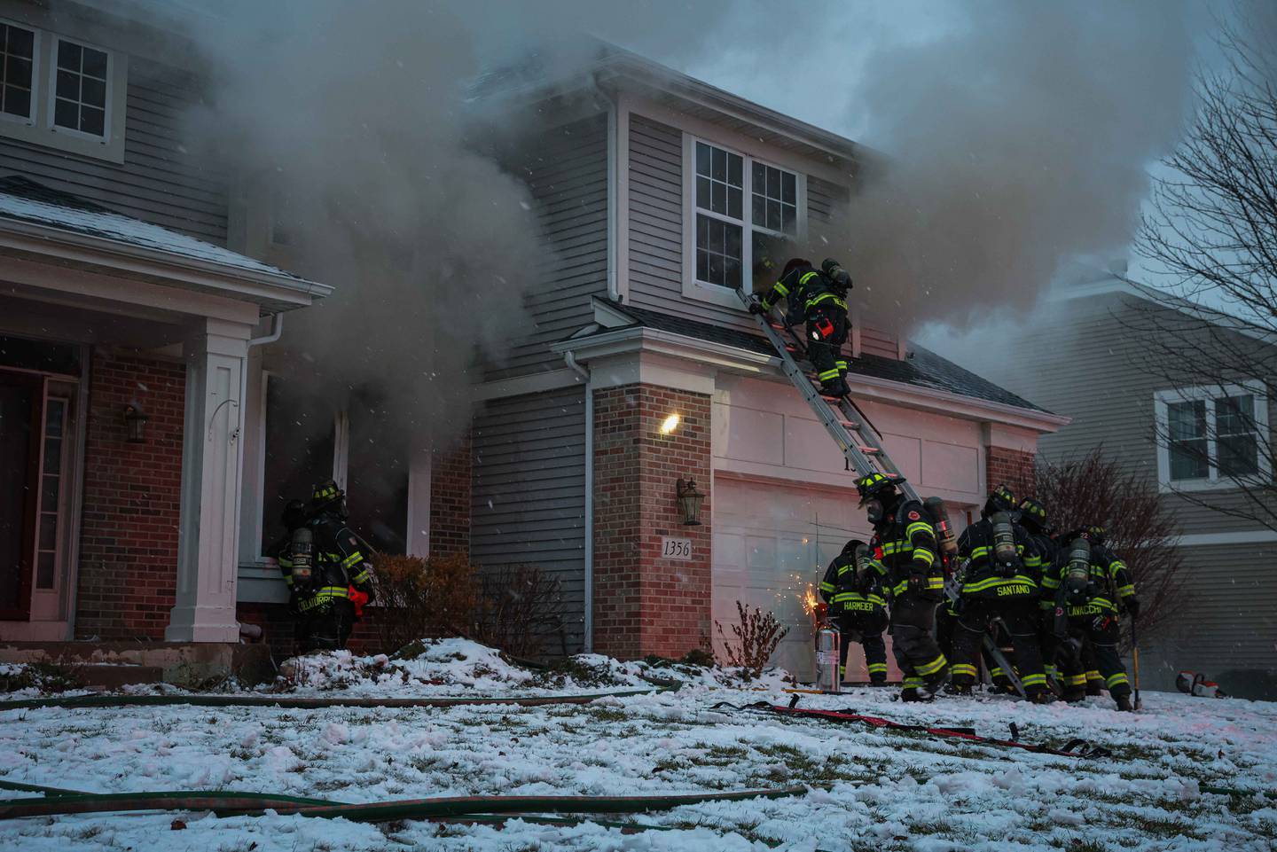 Crews battle a large fire that engulfed a Cary home on Dec. 31, 2025. A dog was missing after the blaze.