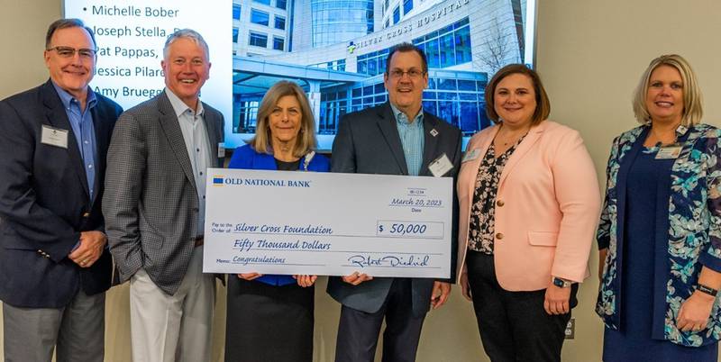 Old National Bank presented its first installment of their Corporate Philanthropy Partnership donation at the Silver Cross Community Trustees Lunch on April 20. Pictured from left to right: Craig Lyons, chairman of the Silver Cross Foundation board; Mike Scudder, executive chairman, Old National Bank; Ruth Colby, president/CEO, Silver Cross Hospital; Bob Diedrich, market president, Old National Bank; Sarah Kinsella, community relations manager/vice president, Old National Bank; and Tracy Simons, executive director, Silver Cross Foundation.