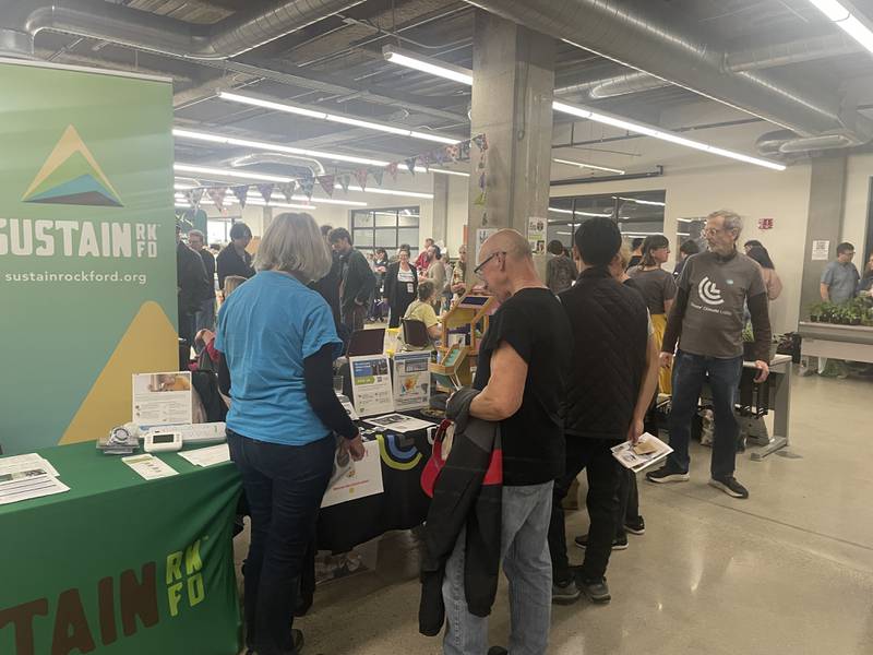 Vendors engage in conversation with attendees during the annual DeKalb County Earth Fest Saturday, April 11, 2026, in NIU's Founders Memorial Library in DeKalb.