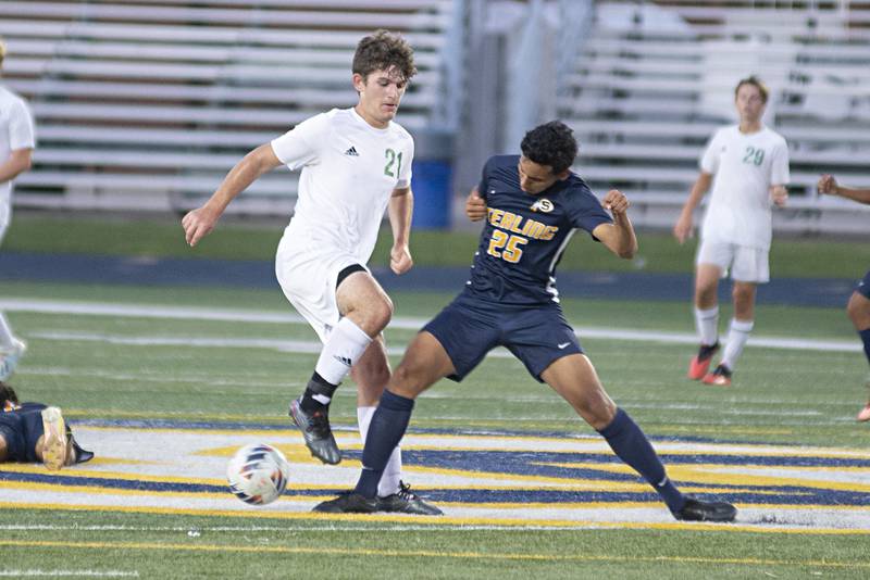 Sterling’s Felipe Sandoval works against Geneseo's Kyle Rahn Tuesday, Sept. 20, 2022.