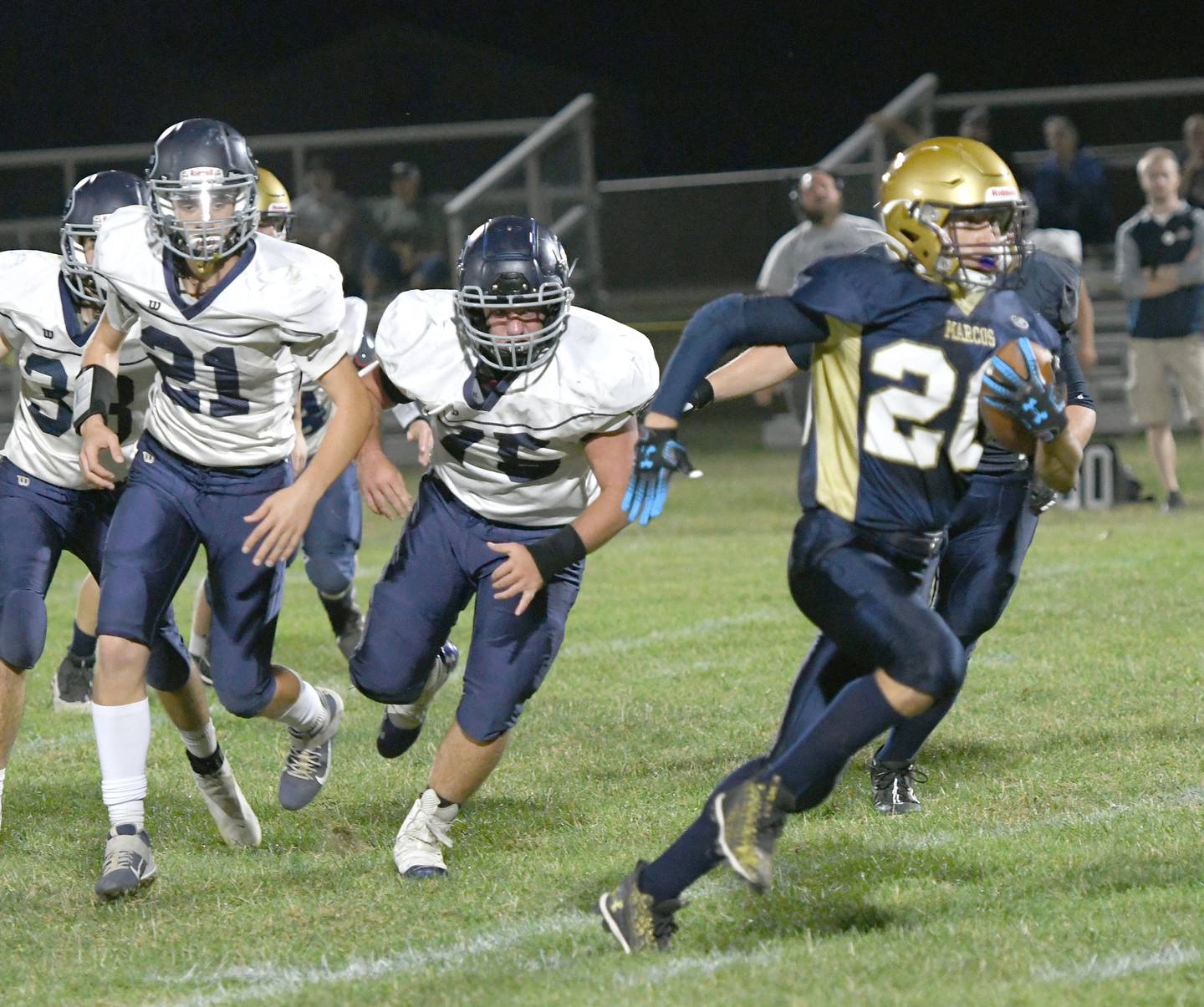 Polo's Avery Grenoble runs away from River Ridge defenders.