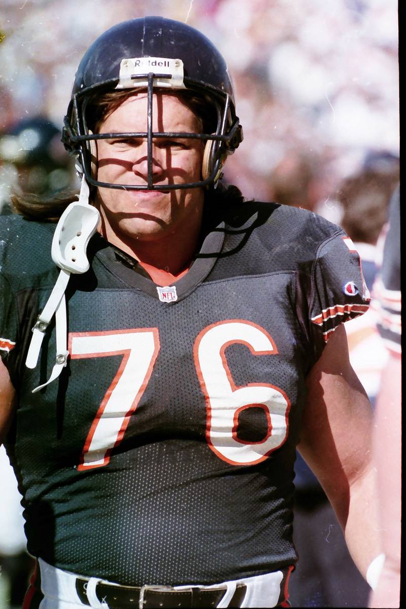 Chicago Bears defensive lineman Steve McMichael watches from the sidelines during a game in 1990.