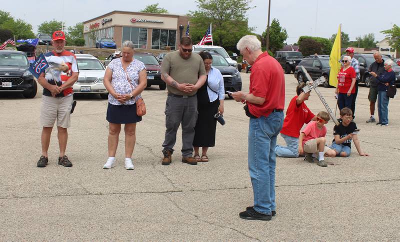 Tim Beck of The Foundation to Promote Personal Responsibility reads a prayer during the "Rally of the Silent Majority" on May 17, 2026, in McHenry.