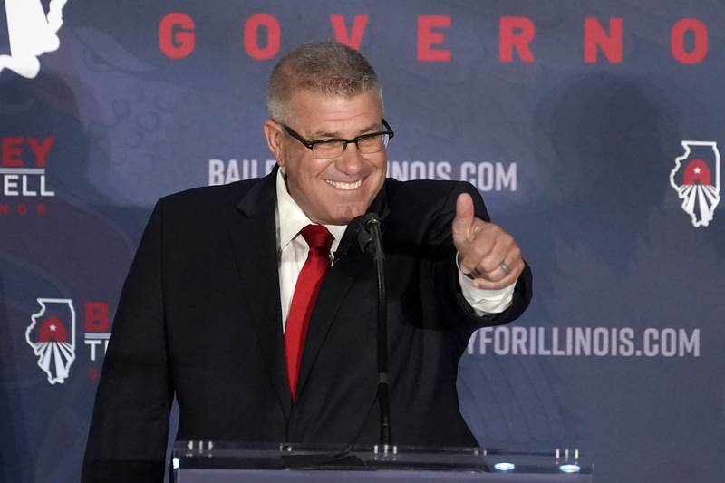 Republican gubernatorial candidate Illinois state Sen. Darren Bailey gestures to the crowd after winning the Republican primary Tuesday, June 28, 2022, in Effingham, Ill. Bailey will now face Democratic Gov. J.B. Pritzker in the fall. (AP Photo/Charles Rex Arbogast)