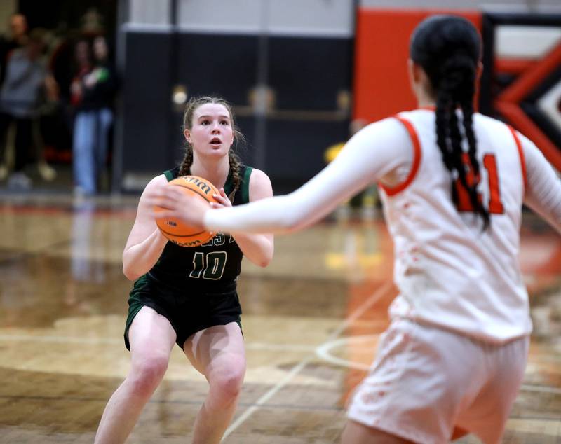 Glenbard West's Julia Benjamin looks for an opening during a Class 4A St. Charles East Sectional semifinal against St. Charles East on Tuesday, Feb. 25, 2025 in St. Charles.