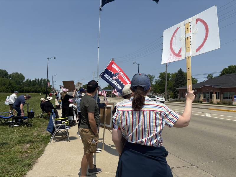 People rally against President Donald Trump in Huntley May 31, 2025.