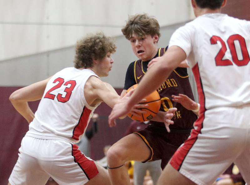 Richmond-Burton’s Gavin Radmer navigates heavy traffic against Stillman Valley during 74th Annual E.C. Nichols Holiday Classic varsity boys basketball tournament action on Saturday, Dec. 28, 2024 at Marengo High School in Marengo.