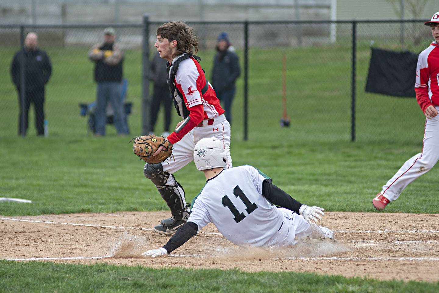 Rock Falls’ Gavin Sands slides in safely at home Monday, April 25, 2022 against Oregon.