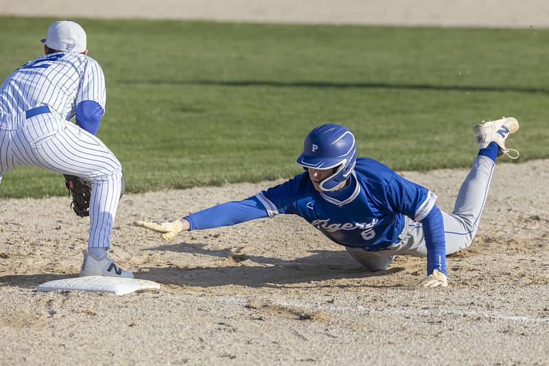 Princeton’s Abram Longeville dives back to first against Newman Monday, April 6, 2026.