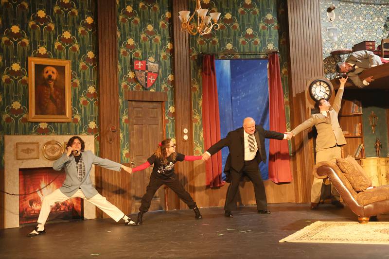 Nick Adams, Anna Klobnak, Scott Harl, Robbie Malerk, and Alex Guerrero act out a scene during rehearsal of “The Play That Goes Wrong” on Tuesday, March 31, 2026 at Stage 212 in La Salle.