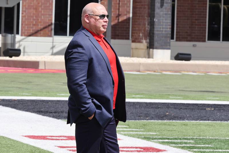 Northern Illinois University Vice-President and Director of Athletics & Recreation Sean Frazier watches football practice Tuesday, Aug. 9, 2022, in Huskie Stadium at NIU.