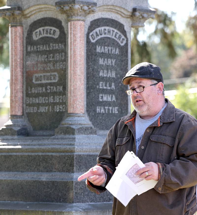 Volunteer Joe McCormick talks about the life of Marshal Stark, who was an early pioneer, during the Etched in Stone cemetery walk Sunday, Oct. 9, 2022, at Elmwood Cemetery in Sycamore. The event, hosted by the DeKalb County History Center, told the stories of some local individuals who are buried there.
