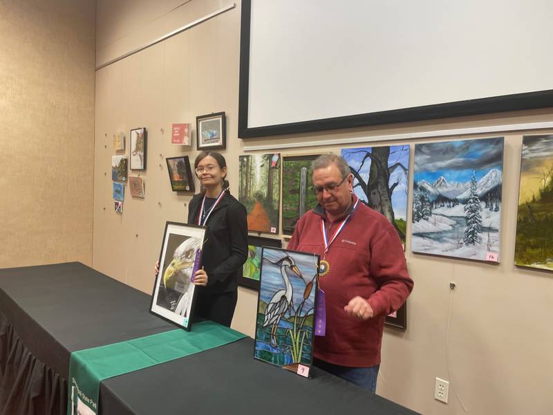 Helena Lopez, 13, of Oak Park and Gerard Spitz of LaMoille pose with their Best in Show entries at the Starved Rock Art Show. The awards were conferred Saturday, March 1, 2025, at the Starved Rock Visitors Center.