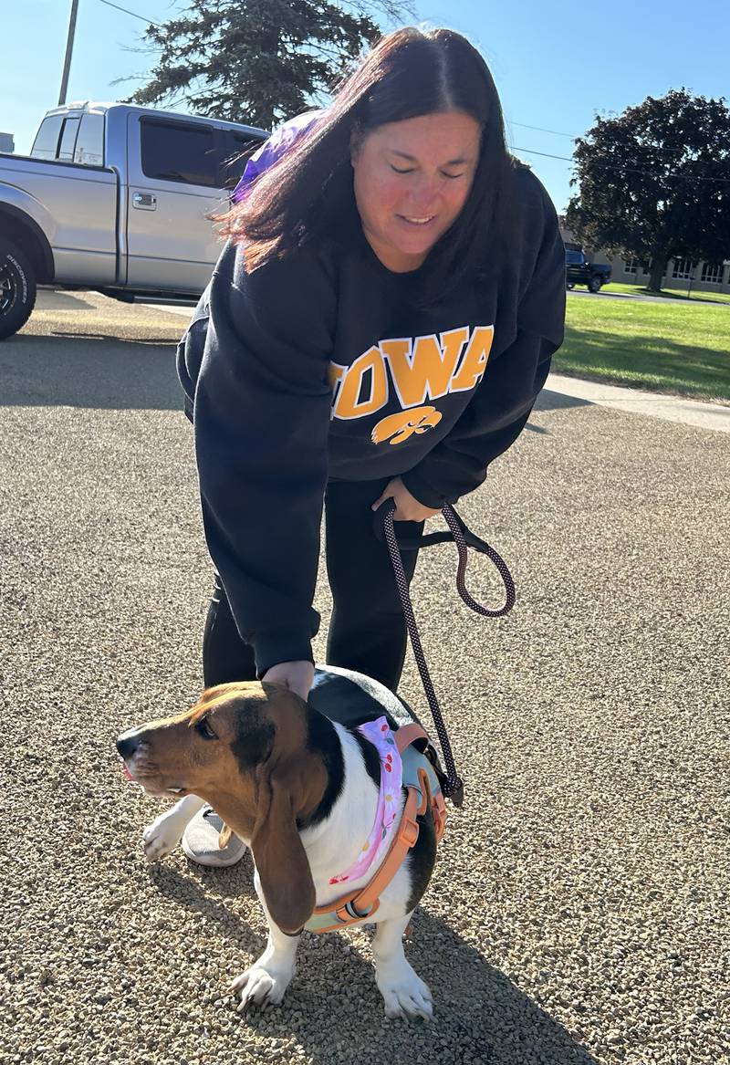 Basset hound Hattie waits patiently with her owner, Chris Wells, at Polo High School’s Doggy Dash on Saturday, Sept. 6, 2025.