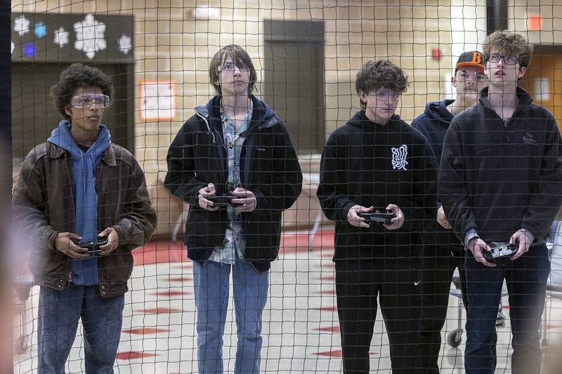 Dixon High School drone soccer team members Zander Schaefer (left), JR Kenney-Oles, Mason Schaefer, David Laird and Owen Tucker scrimmage against Reagan Middle School on Wednesday, Jan. 22, 2025.
