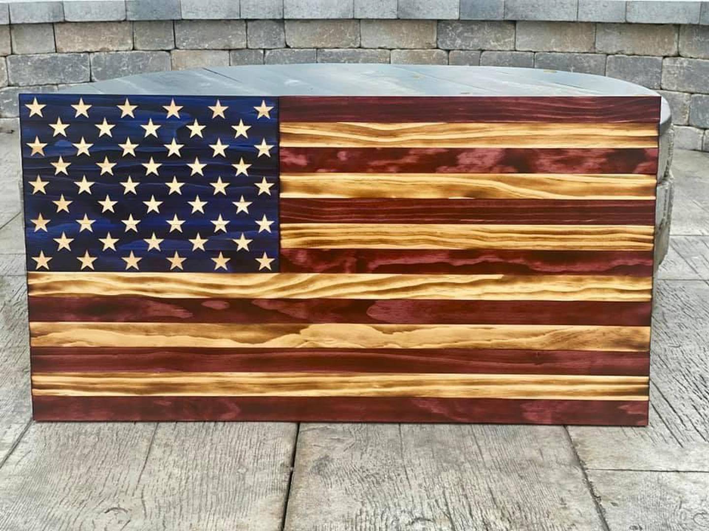 Woodstock North will hold a raffle for this wooden burned/stained American flag.