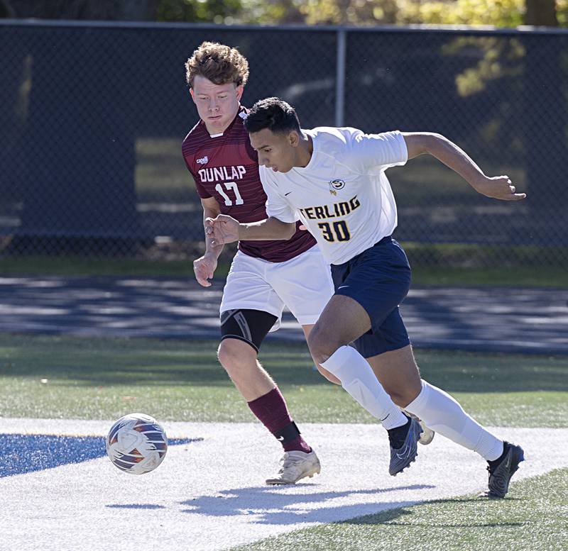 Sterling’s Felipe Sandoval and Dunlap’s Colton Rekes work the field Saturday, Oct. 21, 2023 in the regional finals game in Sterling.