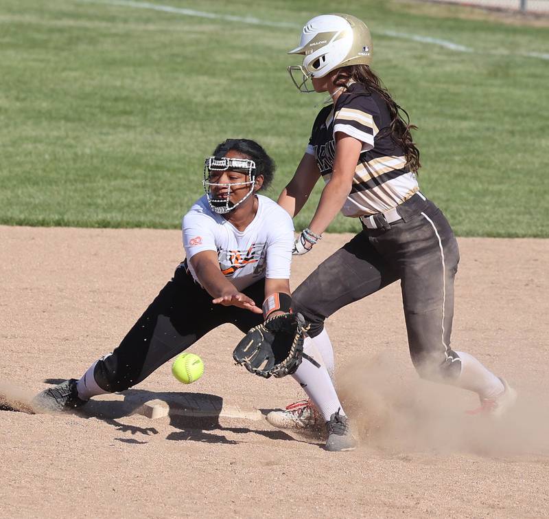 Sycamore's Bella Jacobs gets back safely into second as Freeport's KK Walker-Castle takes the throw during their Class 3A regional championship game Friday, May 26, 2023, at Sycamore High School.