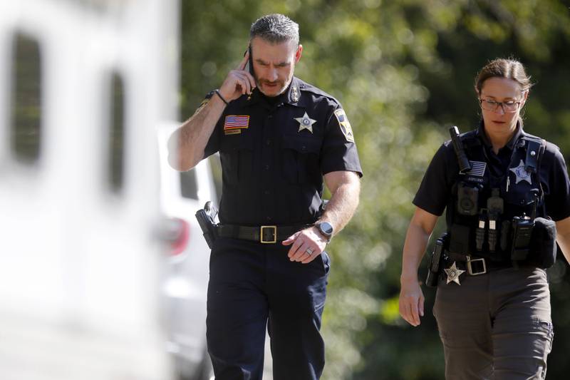 McHenry County Sheriff Robb Tadelman talks on the phone as deputies investigate a shooting in the  8900 block of East Tryon Grove Road Thursday, Oct. 10, 2024.