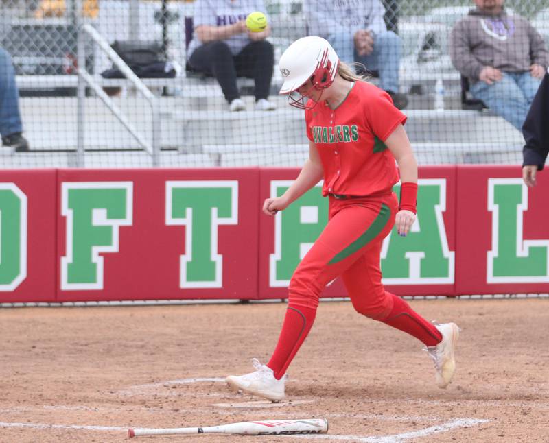 L-P's Taylor Vescogni ducks out of the way as the ball is thrown late to the plate while scoring a run against Rochelle on Wednesday, April 10, 2024 at the L-P Athletic Complex in La Salle.
