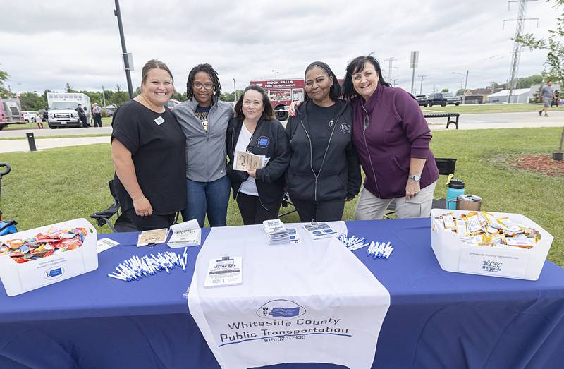 Emily Hammer (left), Devon Neal, Stephanie Schrader, Tina Benson and Denise Garcia of the Whiteside County Senior Center set up a booth to inform people of all they offer Tuesday, Aug. 6, 2024 during National Night Out in Rock Falls.