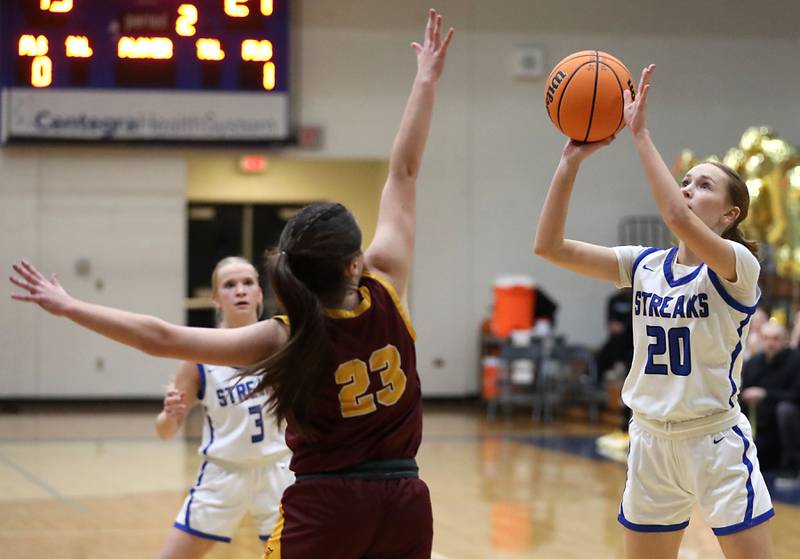 Woodstock's Kendall O'Dea (right) shoots the ball over Richmond-Burton's Morgan Splitt during a Kishwaukee River Conference girls basketball game on Wednesday, Jan. 28, 2026, at Woodstock High School.