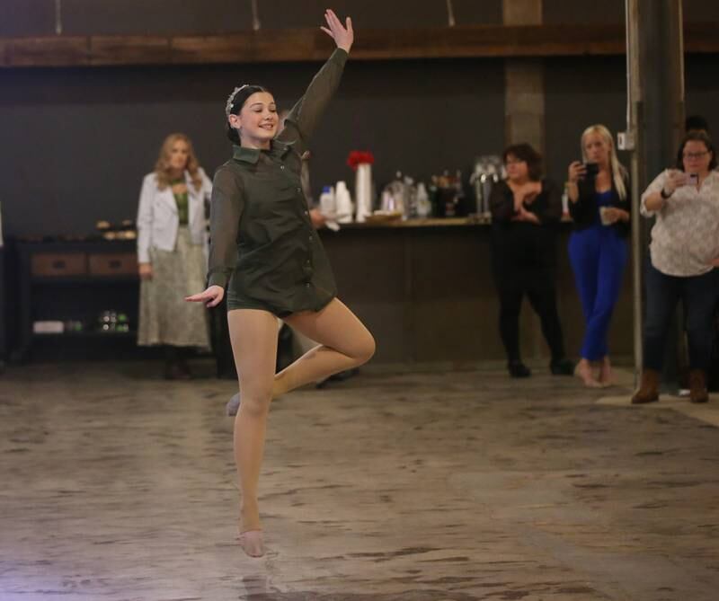Isabella Argubright a senior at La Salle-Peru Township High School dances during the 7th annual Mad Hatter Ball on Friday, Nov. 17, 2023 at the Westclox Event Center in Peru.