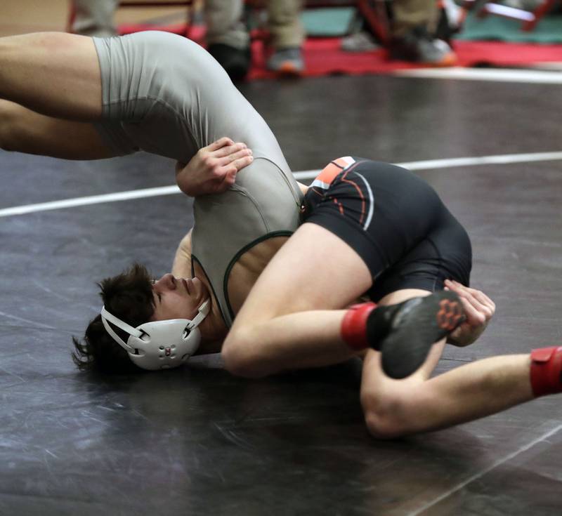 McHenry’s Pedro Jimenez wrestles Stevenson’s Lorenzo Frezza at 126-pounds during the IHSA 3A Individual Sectional wrestling meet at Barrington High School Saturday February 12, 2022.