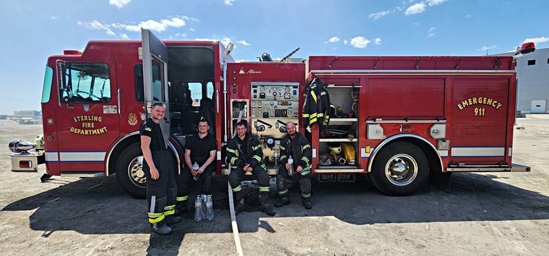 The Odessa crew in their gear, with their new fire engine. "I just can't tell you how appreciative they were," Manson said.