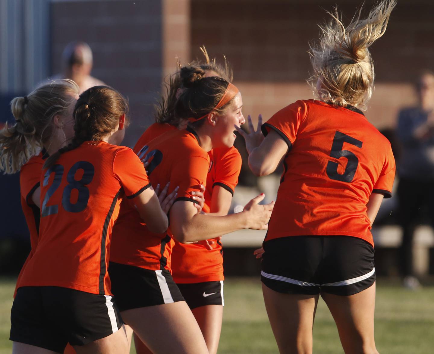 Crystal Lake Central's Shaylee Gough (center) is mugged by here teammates after scoring a goal during the IHSA Class 2A Burlington Central Girls Soccer Sectional final match against Boylan Friday, May 26, 2023, at Burlington Central High School.