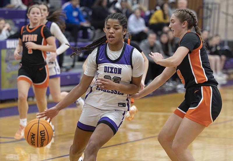 Dixon’s Ahmyrie McGowan drives to the hoop against Byron’s Ryan Smith Saturday, Dec. 27, at the Duchesses Basketball Christmas Classic.