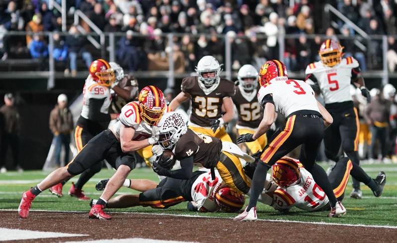 Mt. Carmel's Alonzo Manning (30) carries the ball for a touchdown against Batavia during a class 7A semifinal football playoff game at Mt. Carmel High School in Chicago on Saturday, Nov 18, 2023.