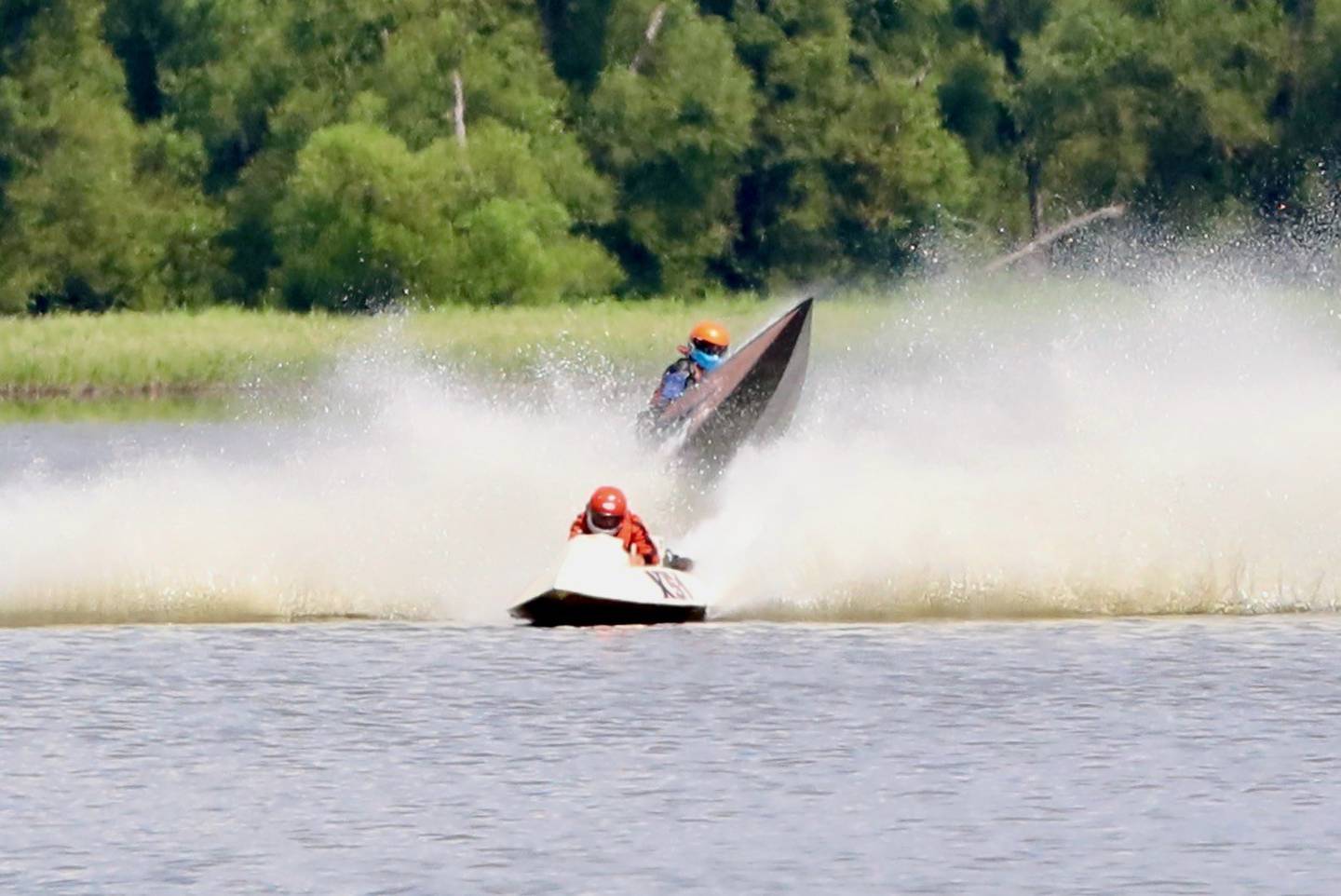 Jerry Davids Sr. in boat N62 flips during Saturday's DePue Boat Races at Lake DePue. He won the 350 Runabout in the last race of the day Sunday.