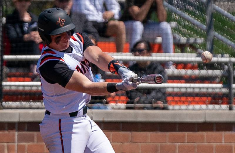 St. Charles East's Al Gaca (12) doubles against St. Charles North during a baseball game at St. Charles East High School on Saturday, May 7, 2022.