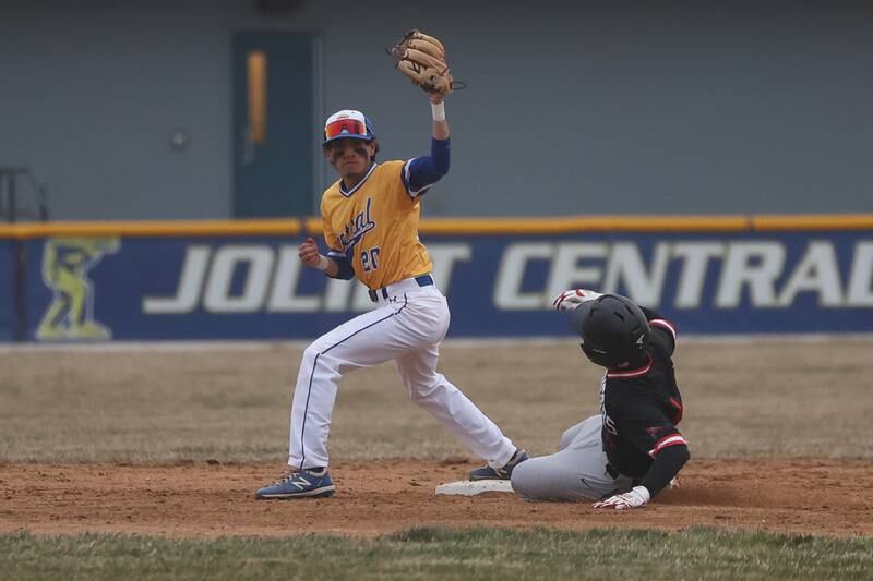 Bolingbrook’s Nathan Maldonado makes the force out to end the inning against Joliet Central on Tuesday, March 21st. 2023.