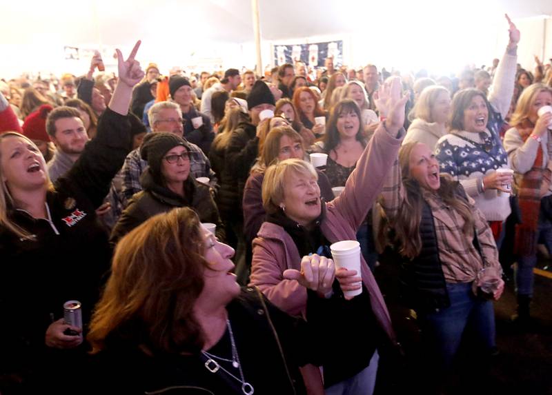 People enjoy the music of 7th heaven on Wednesday afternoon, Nov. 22, 2023, during the 41st annual Turkey Testicle Festival at Parkside Pub, in Huntley. The pre-Thanksgiving festival featured live music, beer, and lots of deep-fried turkey testicles.