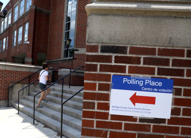 A voter enters the polling place at Downers Grove North High School on Tuesday, June 28, 2022.